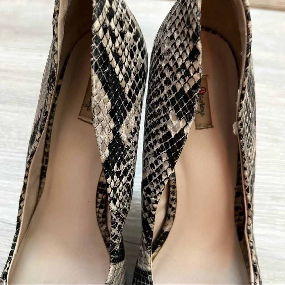 Olsenboye tall platform snakeskin patterned high heels. Closed toe size 9